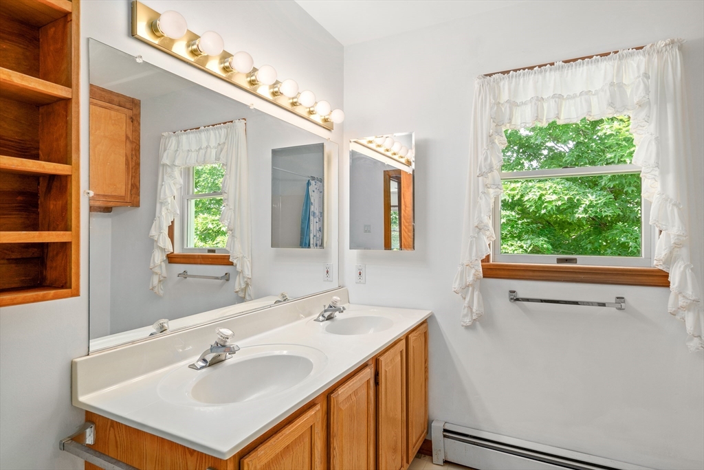 36 Depot Road Hatfield, MA 01038 - Photo 34 of 39 a bathroom with a sink and a mirror