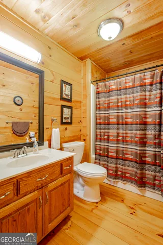 a view of a swimming pool with an outdoor seating and deck