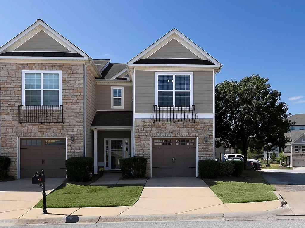 a front view of a house with yard