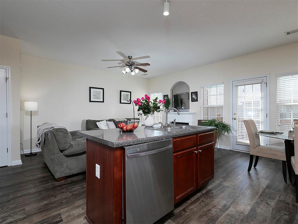 7699 Bucknell Terrace Fairburn, GA 30213 - Photo 13 of 34 a living room with granite countertop furniture and wooden floor