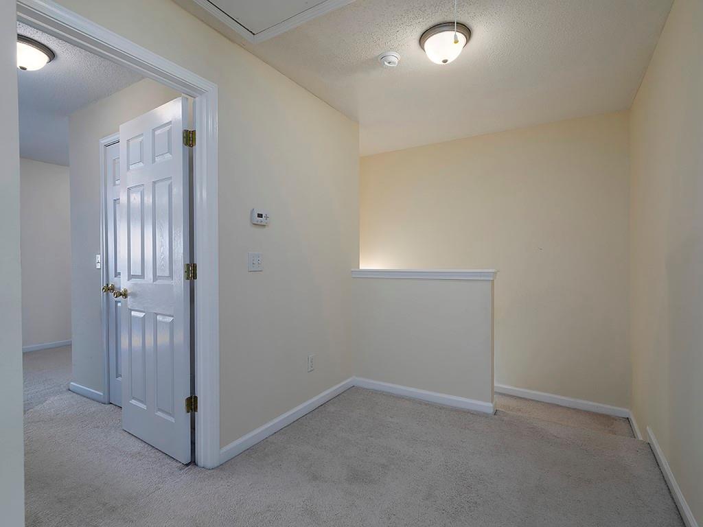 7699 Bucknell Terrace Fairburn, GA 30213 - Photo 16 of 34 an empty room with windows