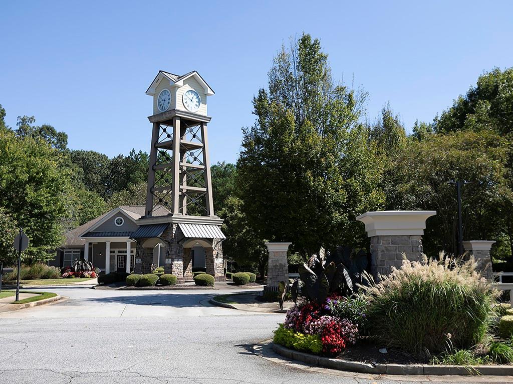 7699 Bucknell Terrace Fairburn, GA 30213 - Photo 32 of 34 a front view of a house with a yard and potted plants
