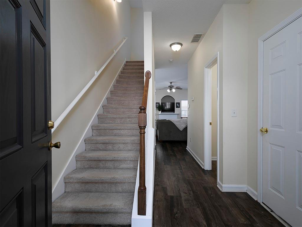 7699 Bucknell Terrace Fairburn, GA 30213 - Photo 4 of 34 a view of a hallway with wooden floor and closet