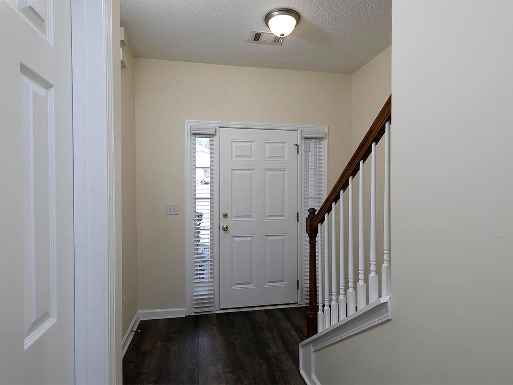 7699 Bucknell Terrace Fairburn, GA 30213 - Photo 5 of 34 an entryway with wooden floor and stairs