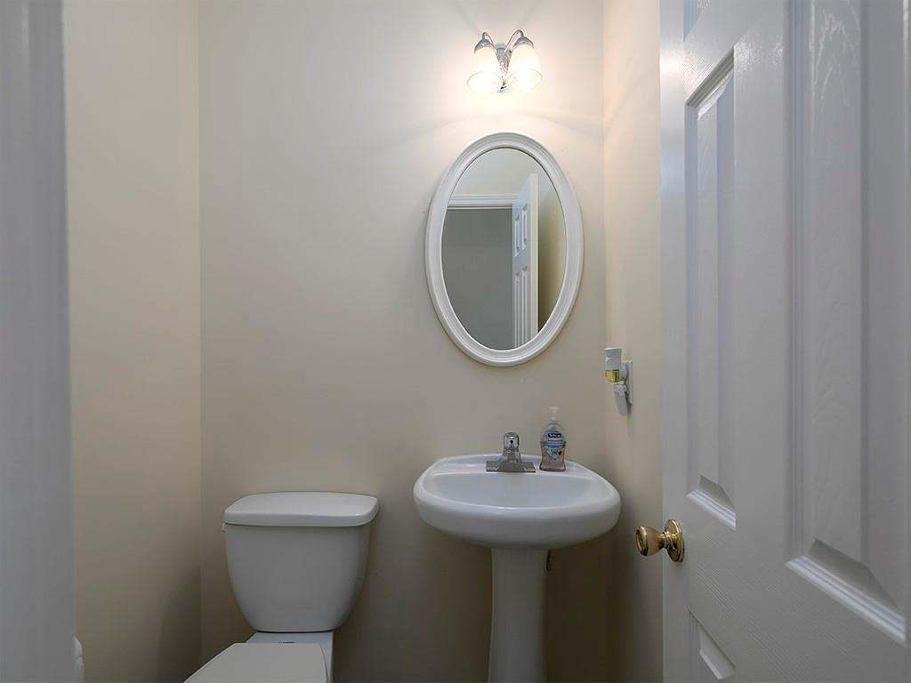 7699 Bucknell Terrace Fairburn, GA 30213 - Photo 6 of 34 a bathroom with a sink and a mirror