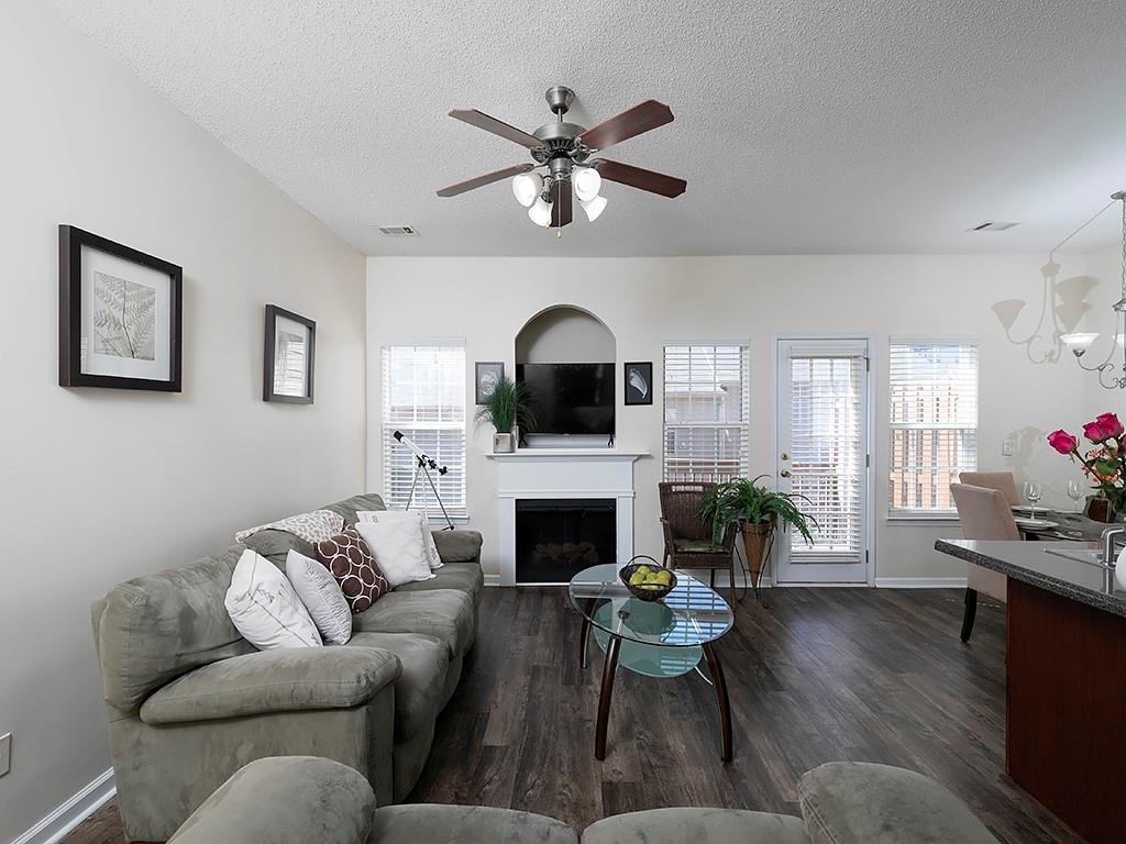 7699 Bucknell Terrace Fairburn, GA 30213 - Photo 7 of 34 a living room with furniture fireplace and window