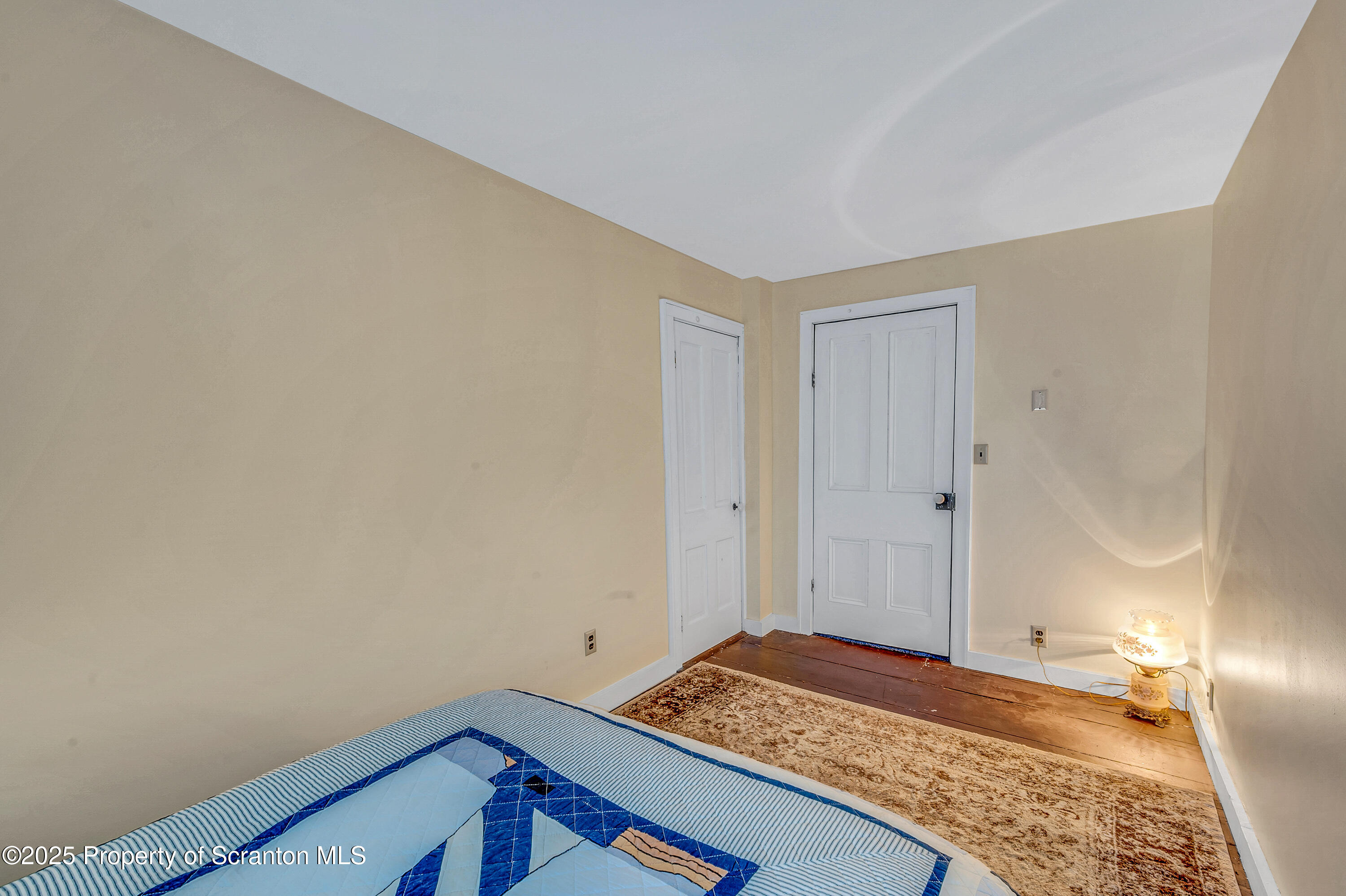 5115 State Rte 3013 Springville, PA 18844 - Photo 56 of 74 a room with a bed and a mirror