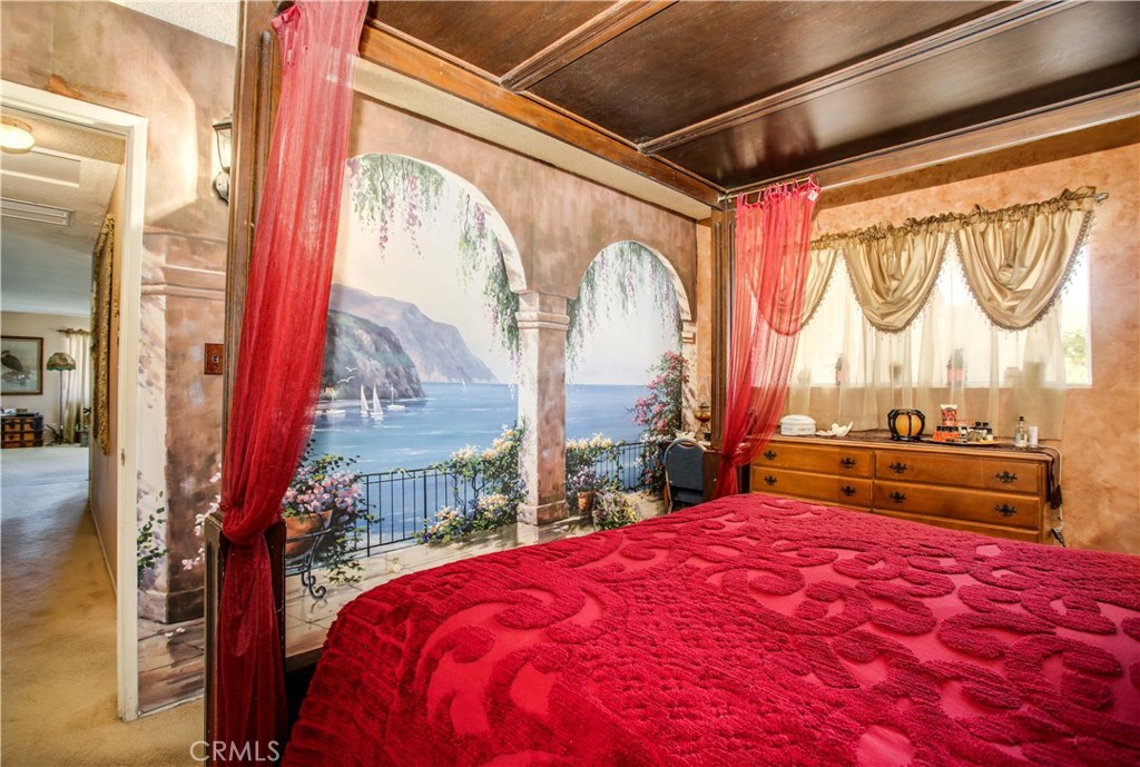 5407 Paradise View Road Yucca Valley, CA 92284 - Photo 23 of 63 a bedroom with a large bed and a large window