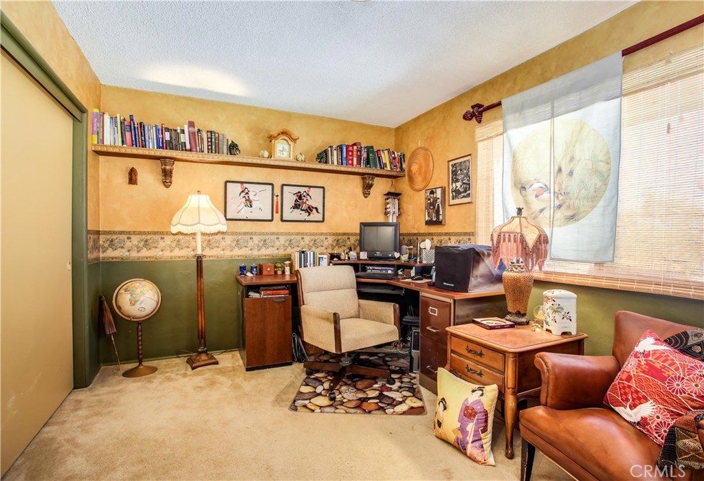 5407 Paradise View Road Yucca Valley, CA 92284 - Photo 24 of 63 a living room with furniture and a window