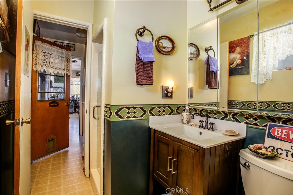 5407 Paradise View Road Yucca Valley, CA 92284 - Photo 26 of 63 a bathroom with a sink and a mirror