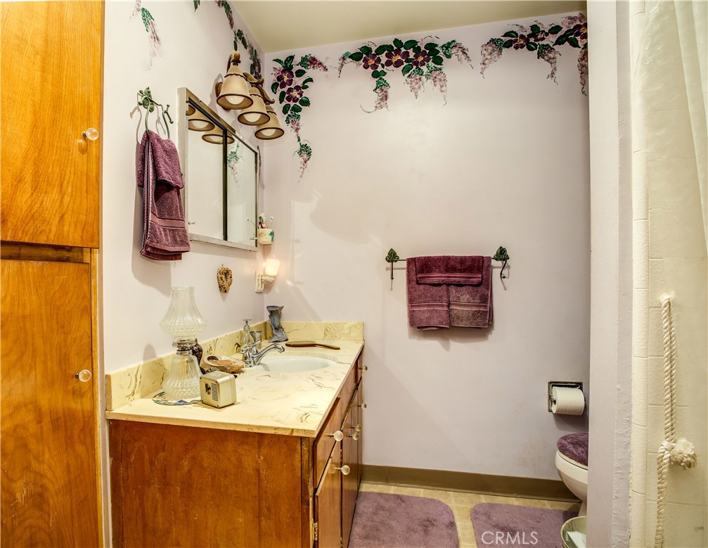 5407 Paradise View Road Yucca Valley, CA 92284 - Photo 29 of 63 a bathroom with a sink and a mirror