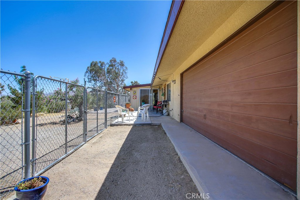 5407 Paradise View Road Yucca Valley, CA 92284 - Photo 56 of 63 a view of a balcony with flat screen tv