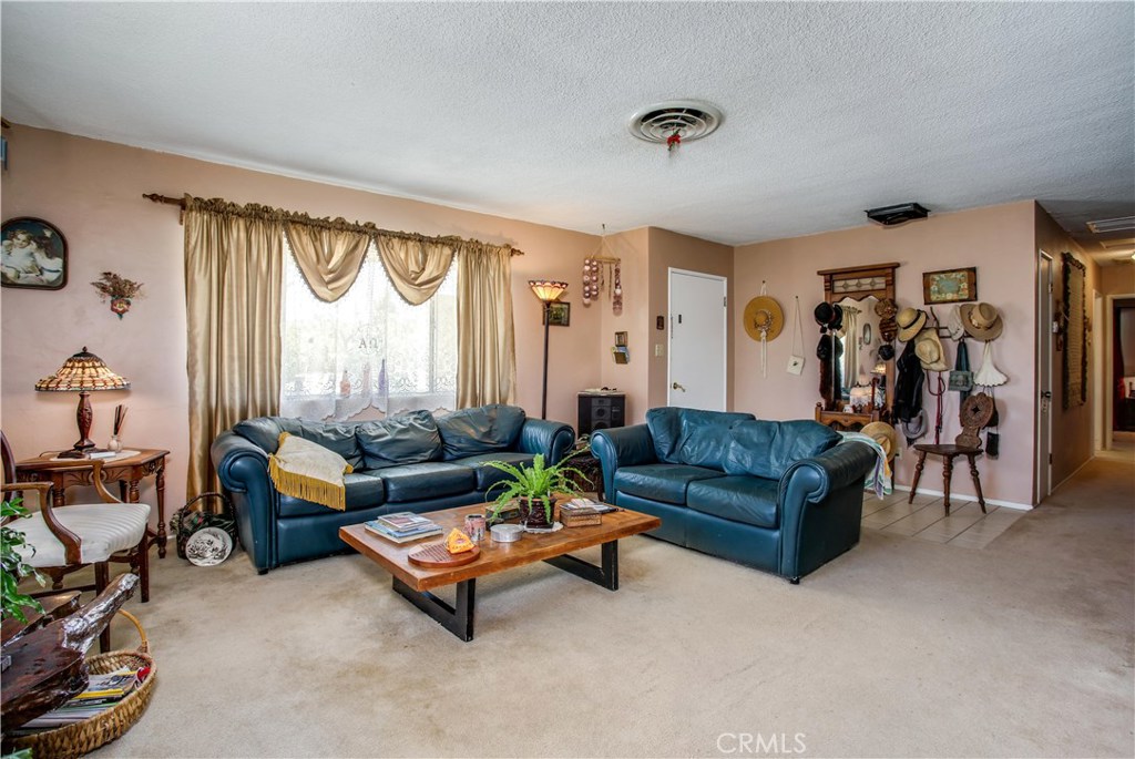 5407 Paradise View Road Yucca Valley, CA 92284 - Photo 9 of 63 a living room with furniture and a large window