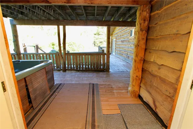 a view of a porch with wooden floor