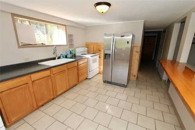 an empty room with windows and entrance