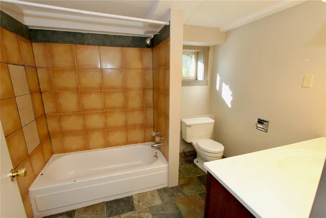 a bathroom with a sink and a toilet