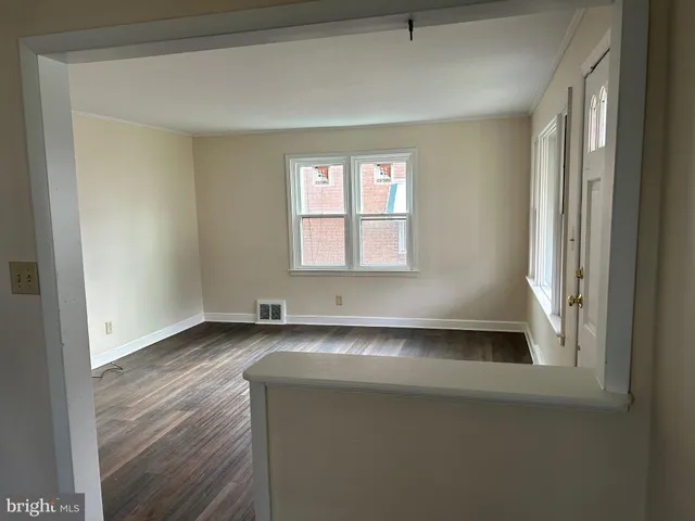 a view of a room that has a bed in it