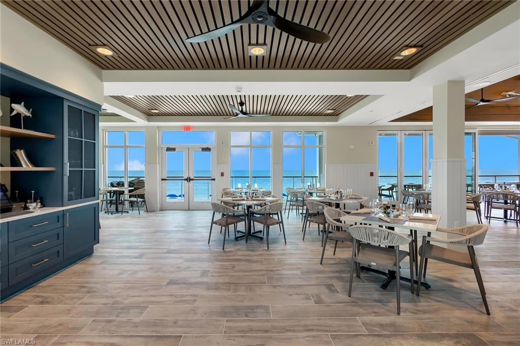 5100 Baybridge Boulevard, Unit 202 Estero, FL 33928 - Photo 24 of 38 a view of a dining room with furniture window and wooden floor
