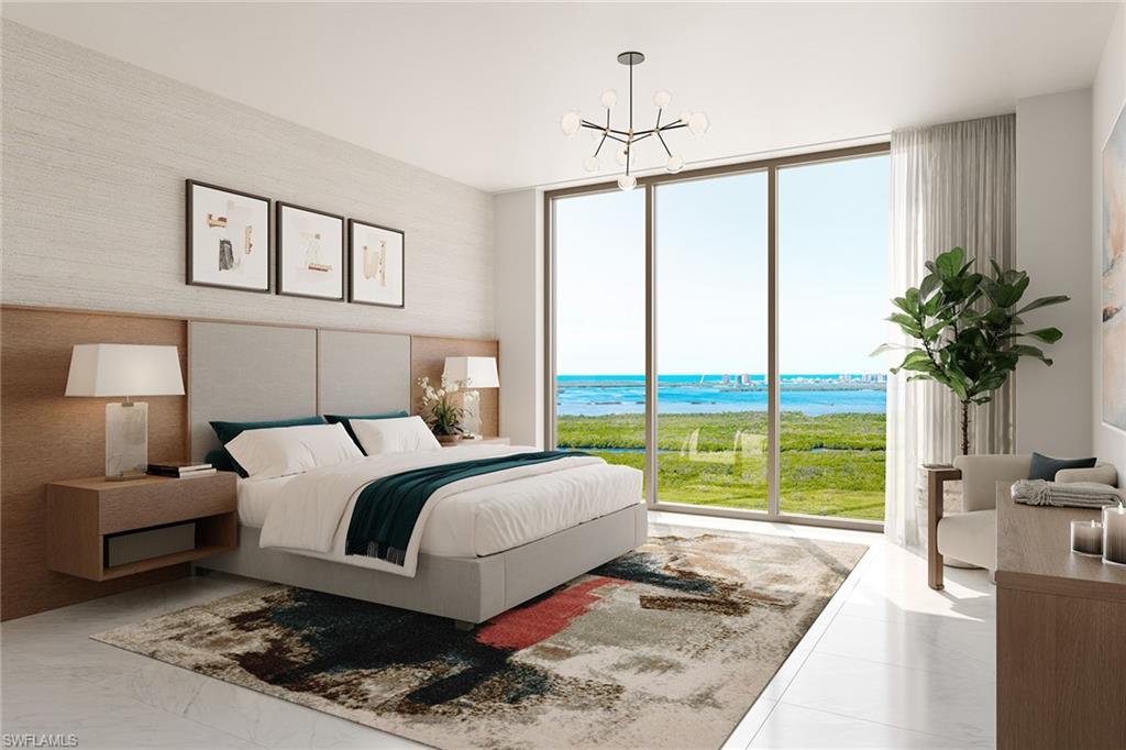 5100 Baybridge Boulevard, Unit 202 Estero, FL 33928 - Photo 3 of 38 a bedroom with a large bed and a window