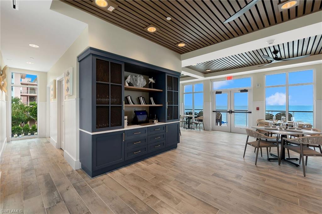 5100 Baybridge Boulevard, Unit 202 Estero, FL 33928 - Photo 31 of 38 a room with furniture window and wooden floor