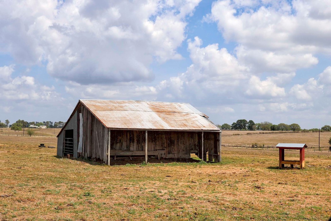6446 Mensik Road Schulenburg, TX 78956 - Photo 7 of 17 a view of a house with a yard