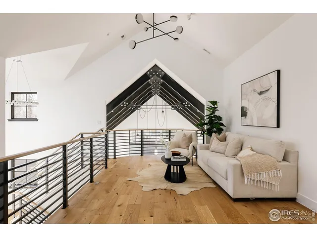 a bedroom with a bed and a large mirror