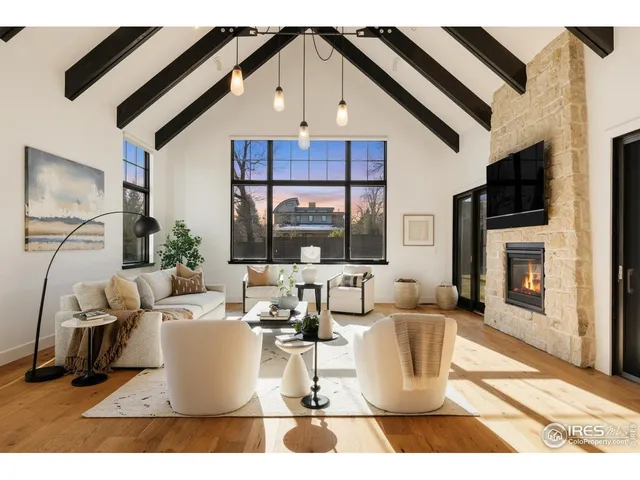 a dining room with furniture and a wooden floor