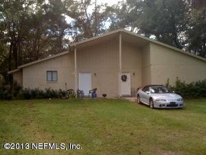 2094 Cornell Road Middleburg, FL 32068 - Photo 1 of 9 a front view of a house with garden