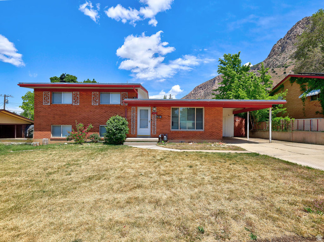 1272 Cook Street Ogden, UT 84404 - Photo 50 of 58 Brick exterior residence with a red-trimmed flat roofline