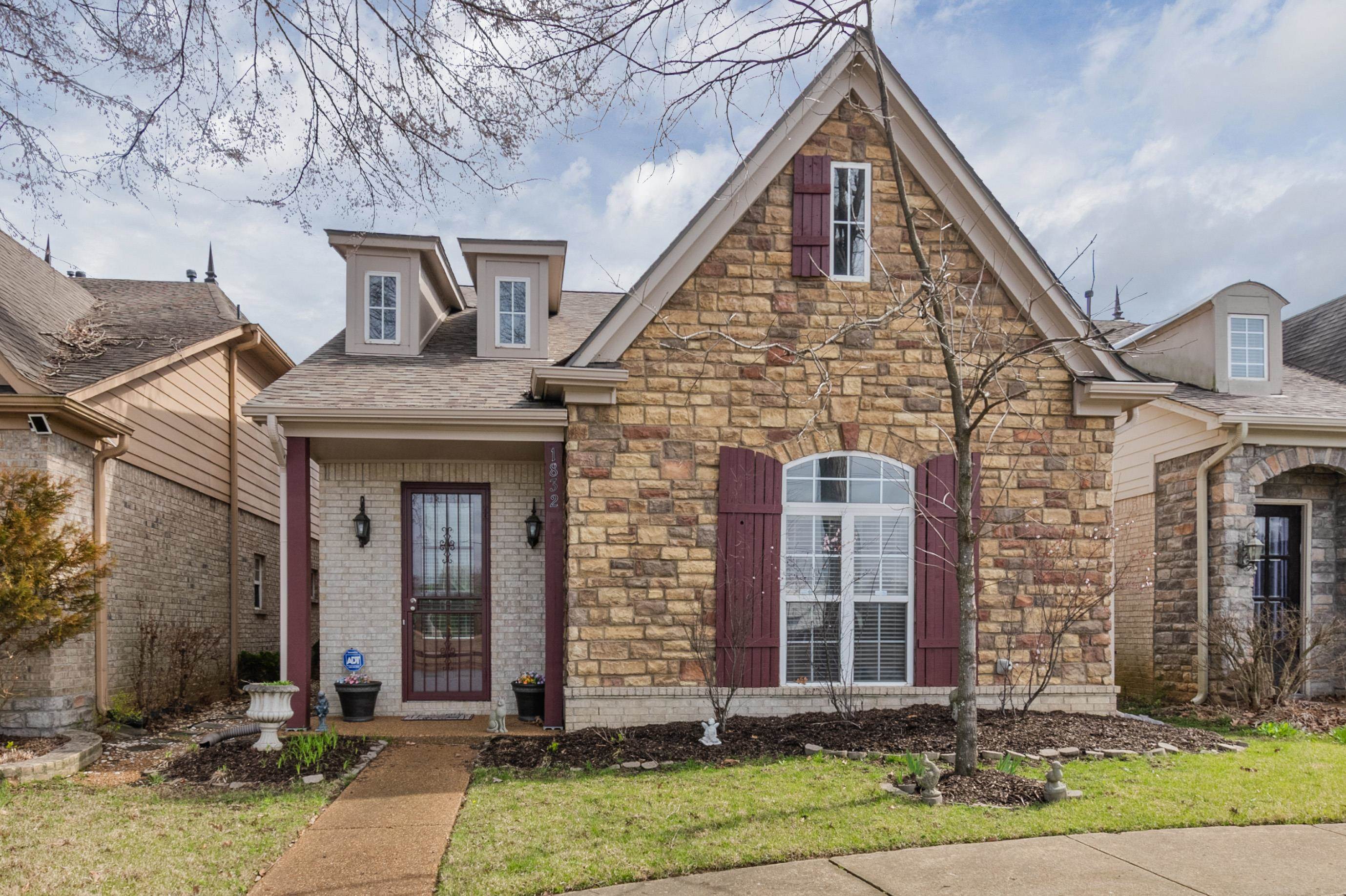 1832 North Houston Levee Road Cordova, TN 38016 - Photo 1 of 23 a front view of a house with garden