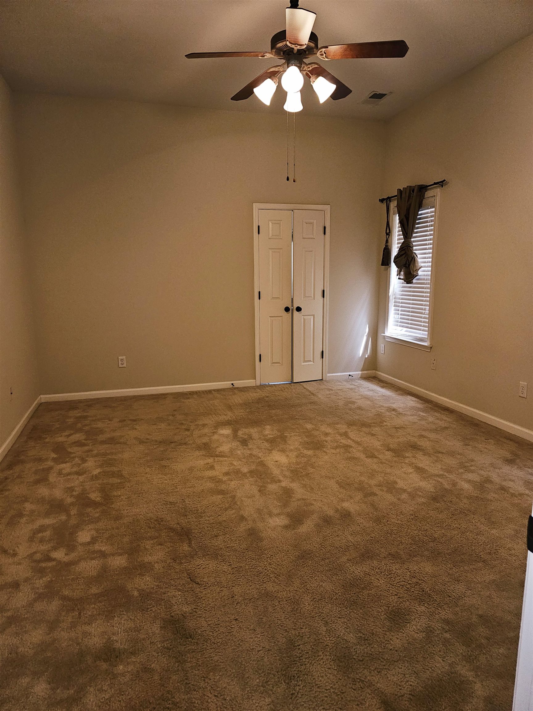1832 North Houston Levee Road Cordova, TN 38016 - Photo 16 of 23 a view of an empty room with window and chandelier fan
