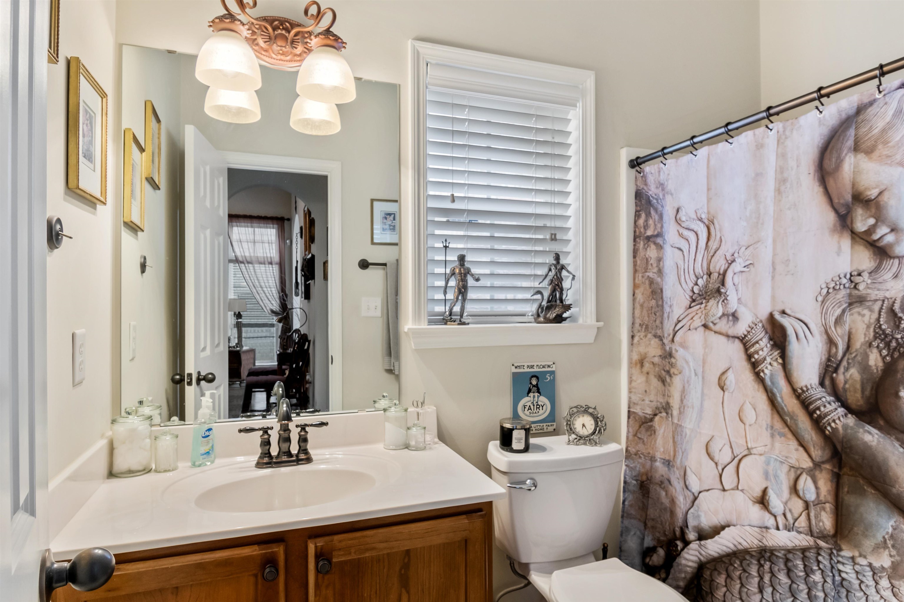 1832 North Houston Levee Road Cordova, TN 38016 - Photo 20 of 23 a bathroom with a sink vanity mirror and toilet