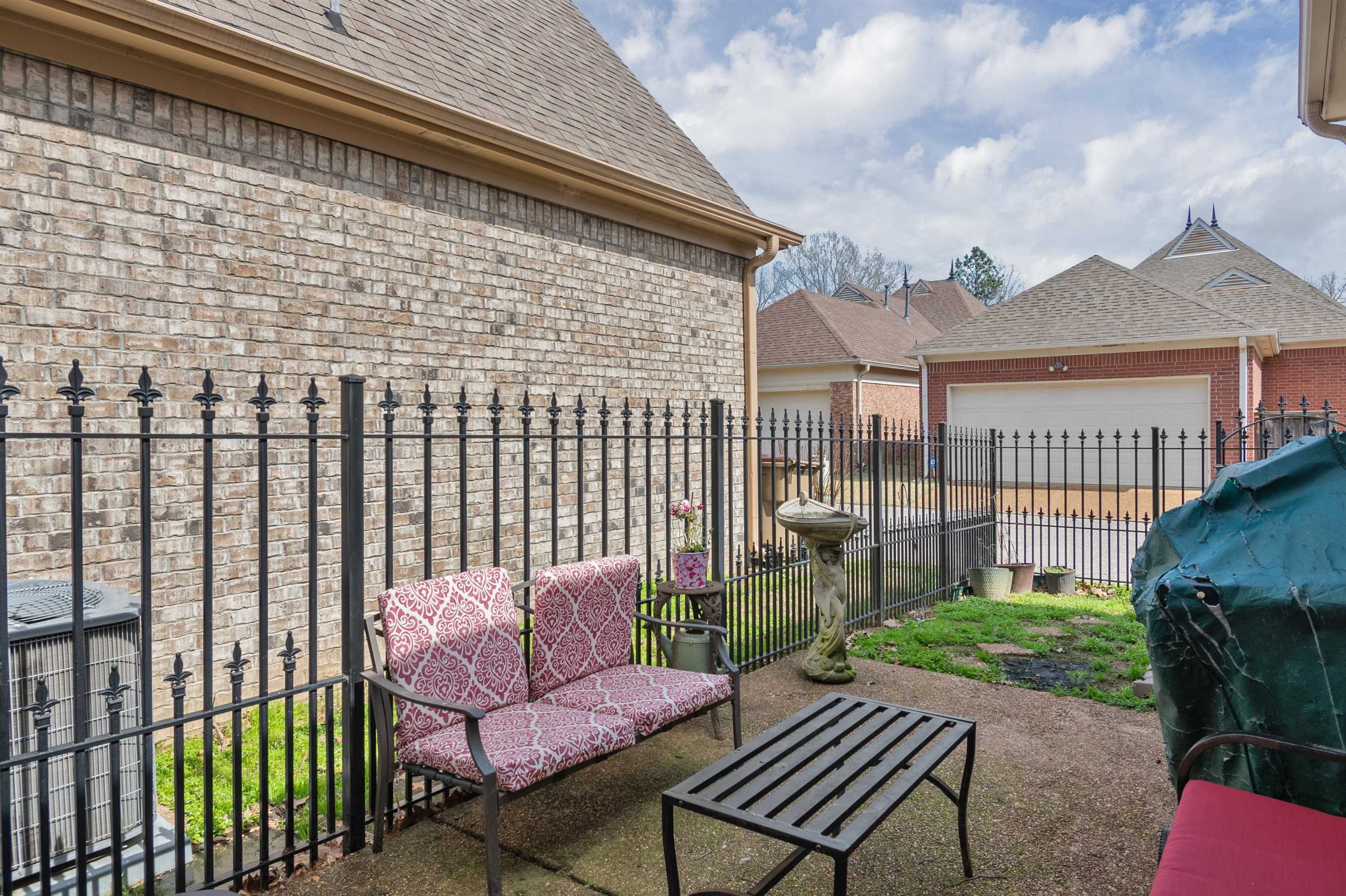 1832 North Houston Levee Road Cordova, TN 38016 - Photo 22 of 23 a view of a patio with a chairs and table in a patio