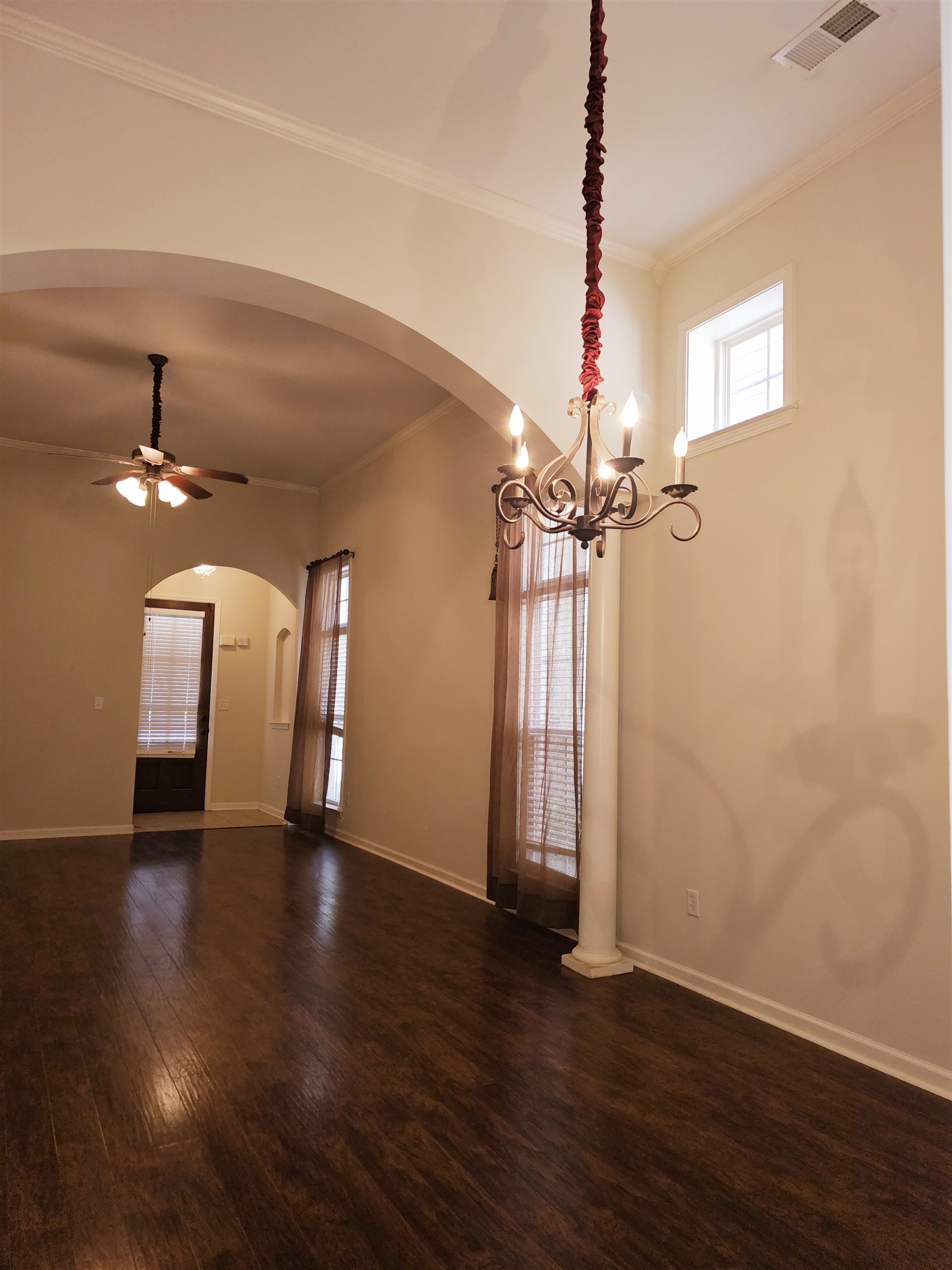 1832 North Houston Levee Road Cordova, TN 38016 - Photo 6 of 23 a view of a room with wooden floor a ceiling fan and windows