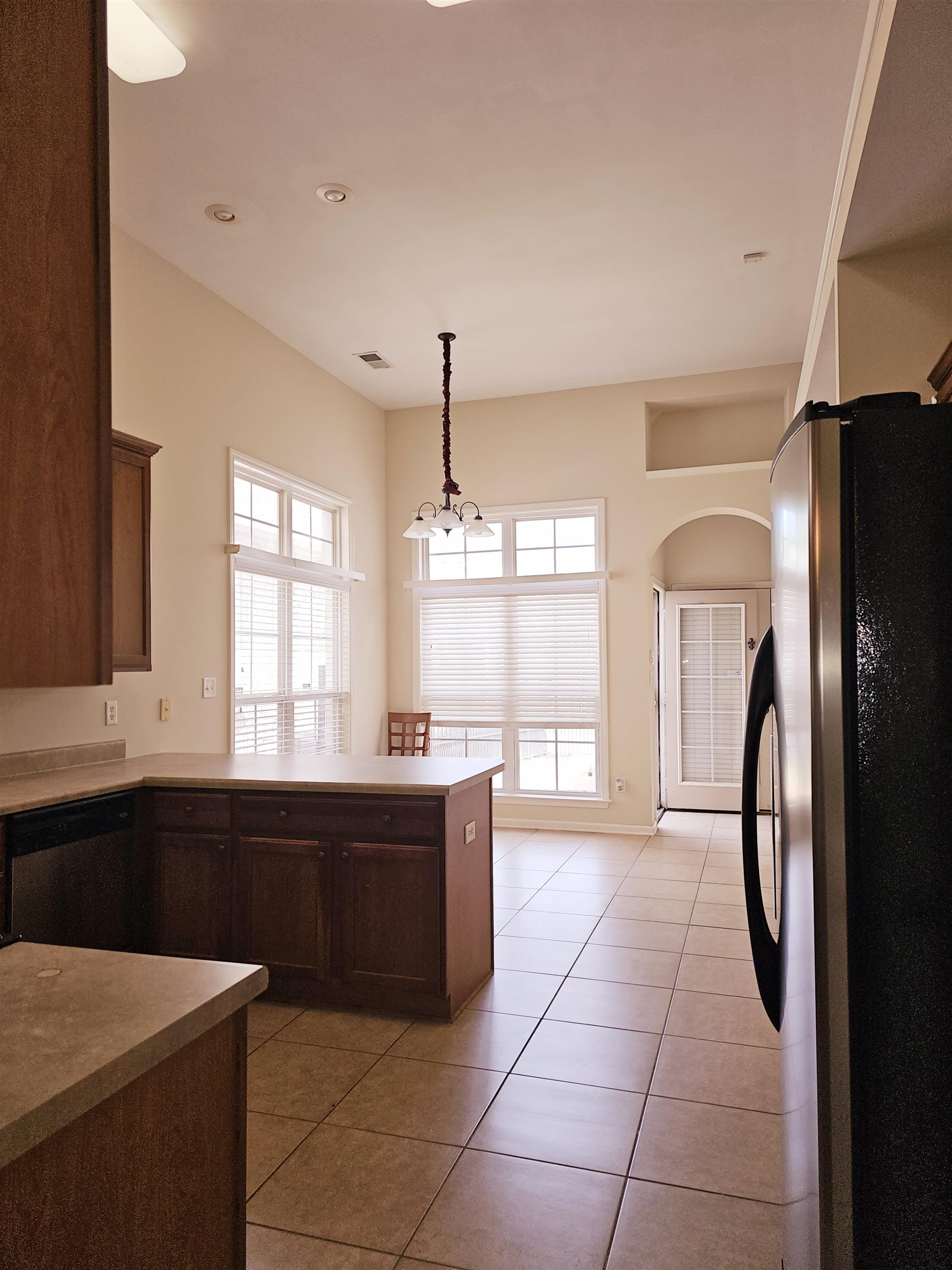 1832 North Houston Levee Road Cordova, TN 38016 - Photo 8 of 23 a kitchen with stainless steel appliances a refrigerator a sink a stove and cabinets