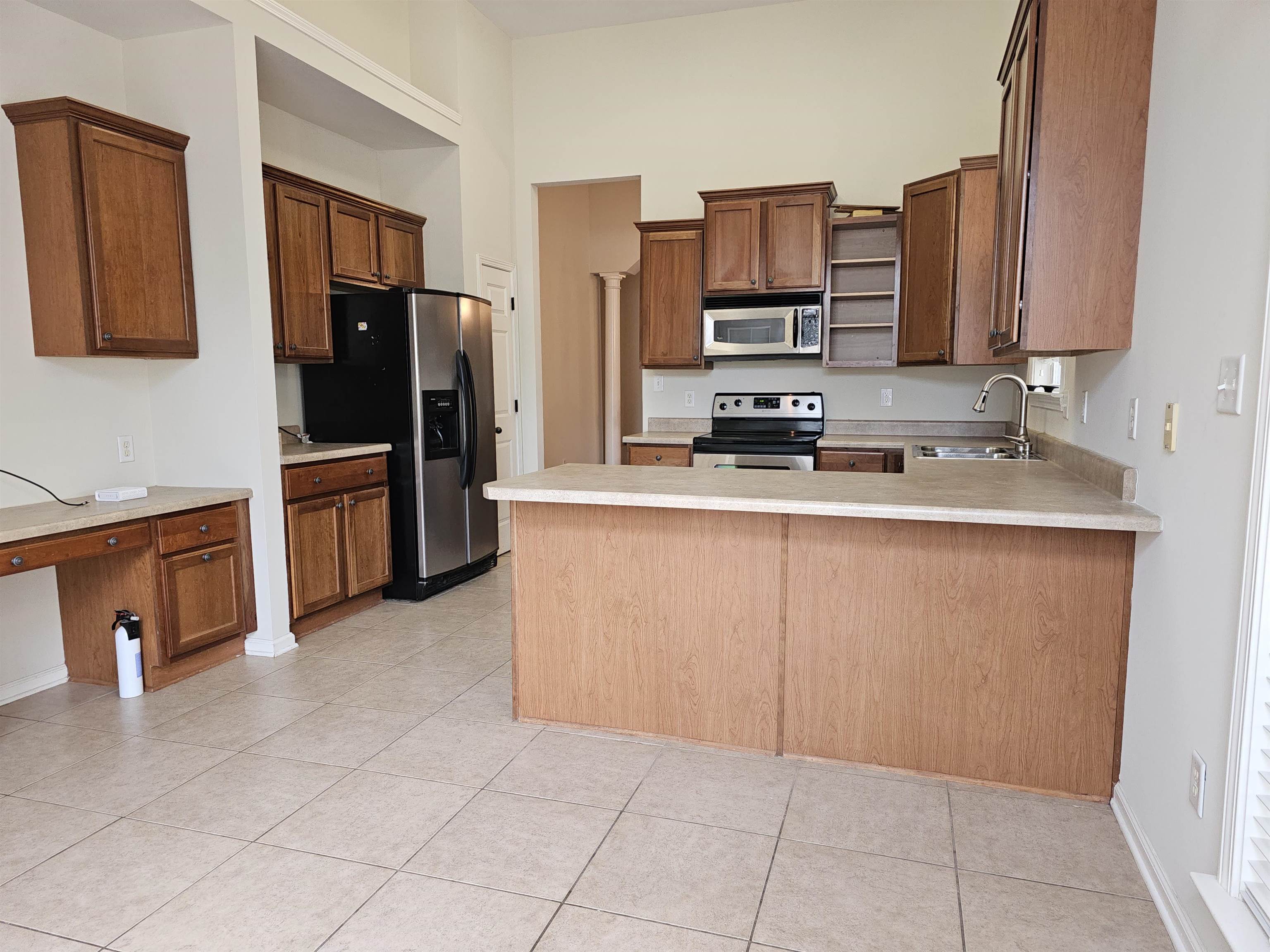 1832 North Houston Levee Road Cordova, TN 38016 - Photo 9 of 23 a kitchen with stainless steel appliances granite countertop a refrigerator stove top oven a sink and dishwasher