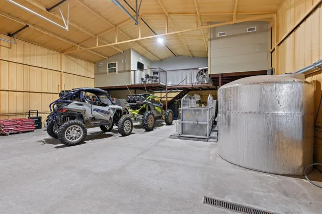 a view of parking garage with cars