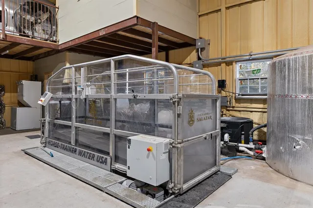 a utility room with dryer and a baby