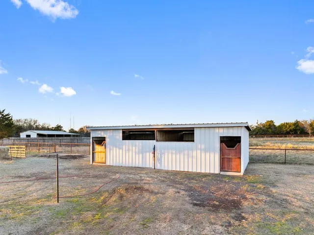 a view of a swimming pool with a table and chairs