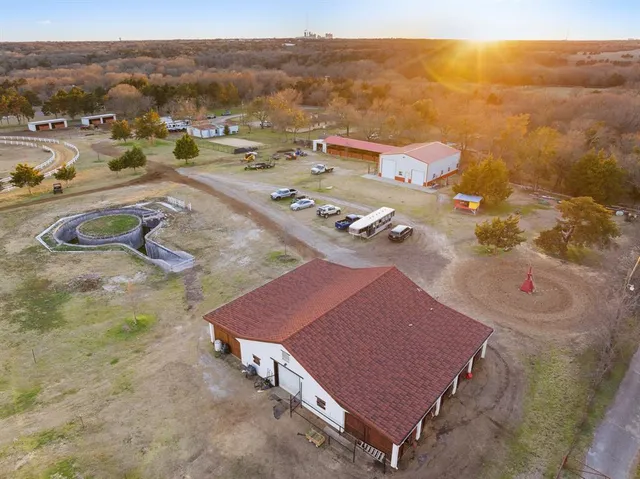 an aerial view of a house with a yard