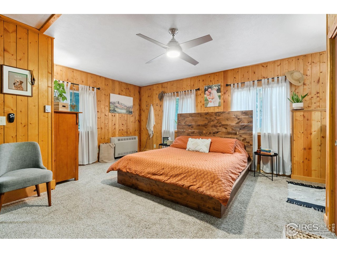 32224 Poudre Canyon Road Bellvue, CO 80512 - Photo 18 of 34 a bedroom with a bed and a couch