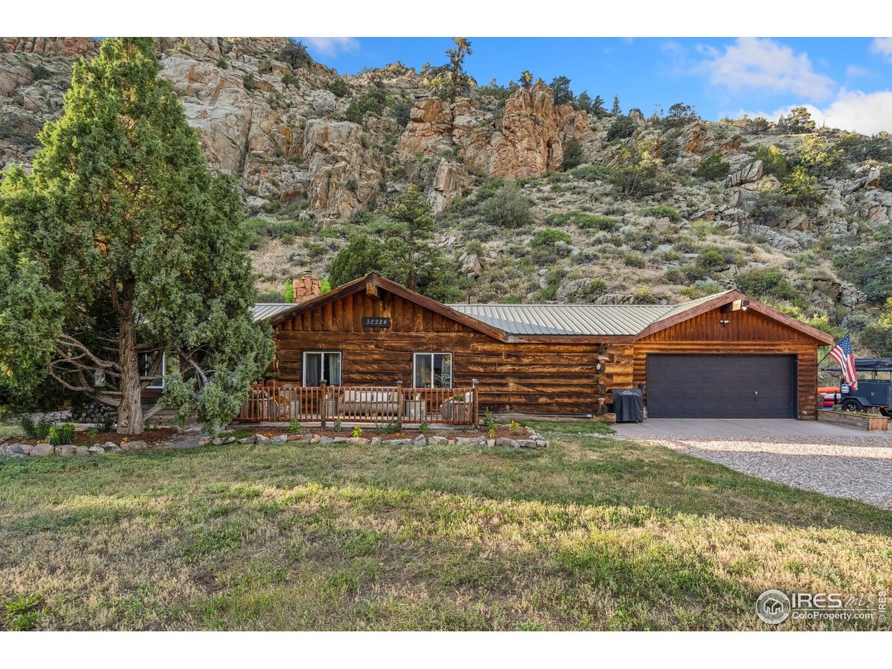 32224 Poudre Canyon Road Bellvue, CO 80512 - Photo 2 of 34 a backyard of a house with table and chairs