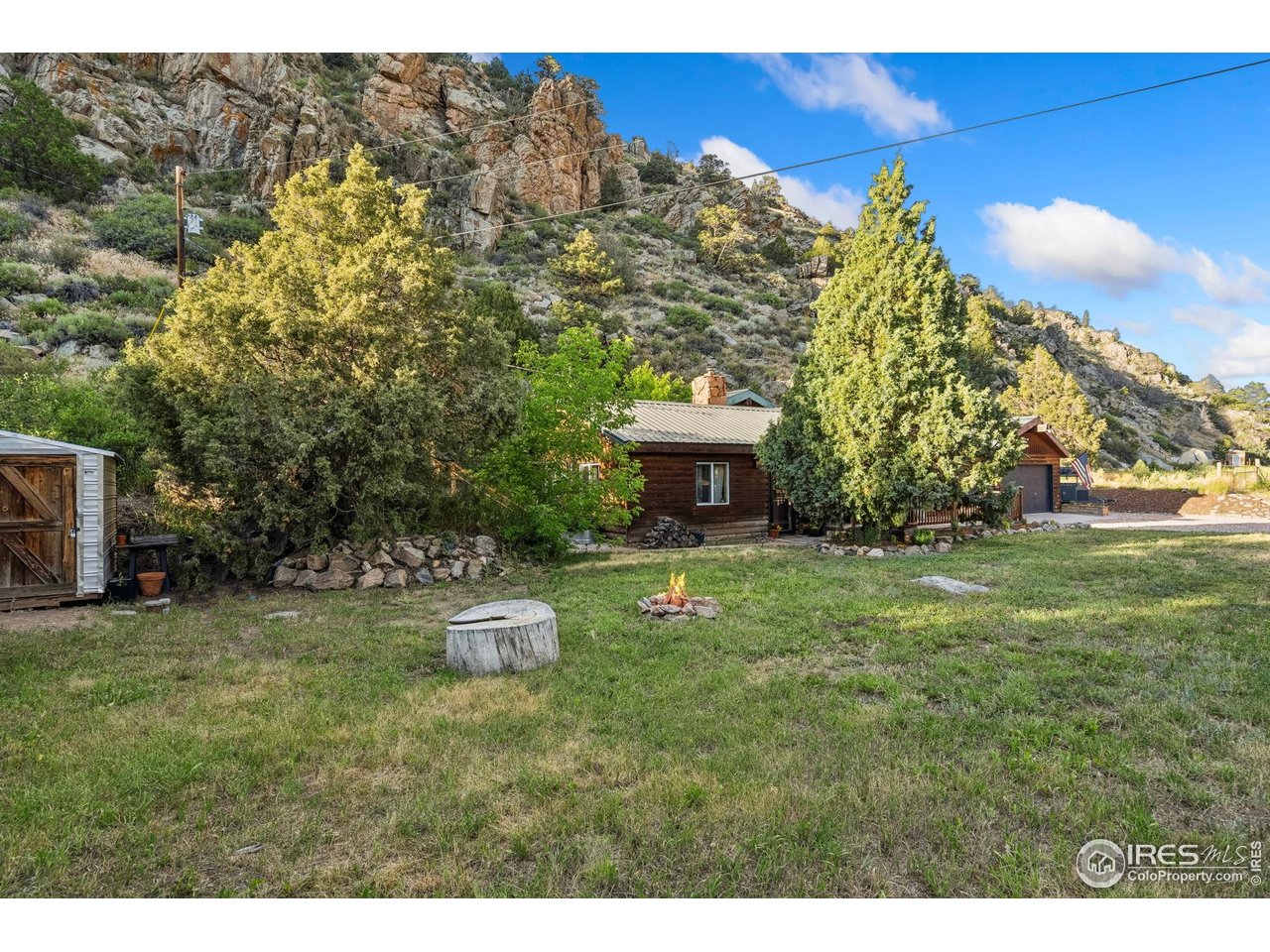 32224 Poudre Canyon Road Bellvue, CO 80512 - Photo 4 of 34 a view of a garden with lawn chairs