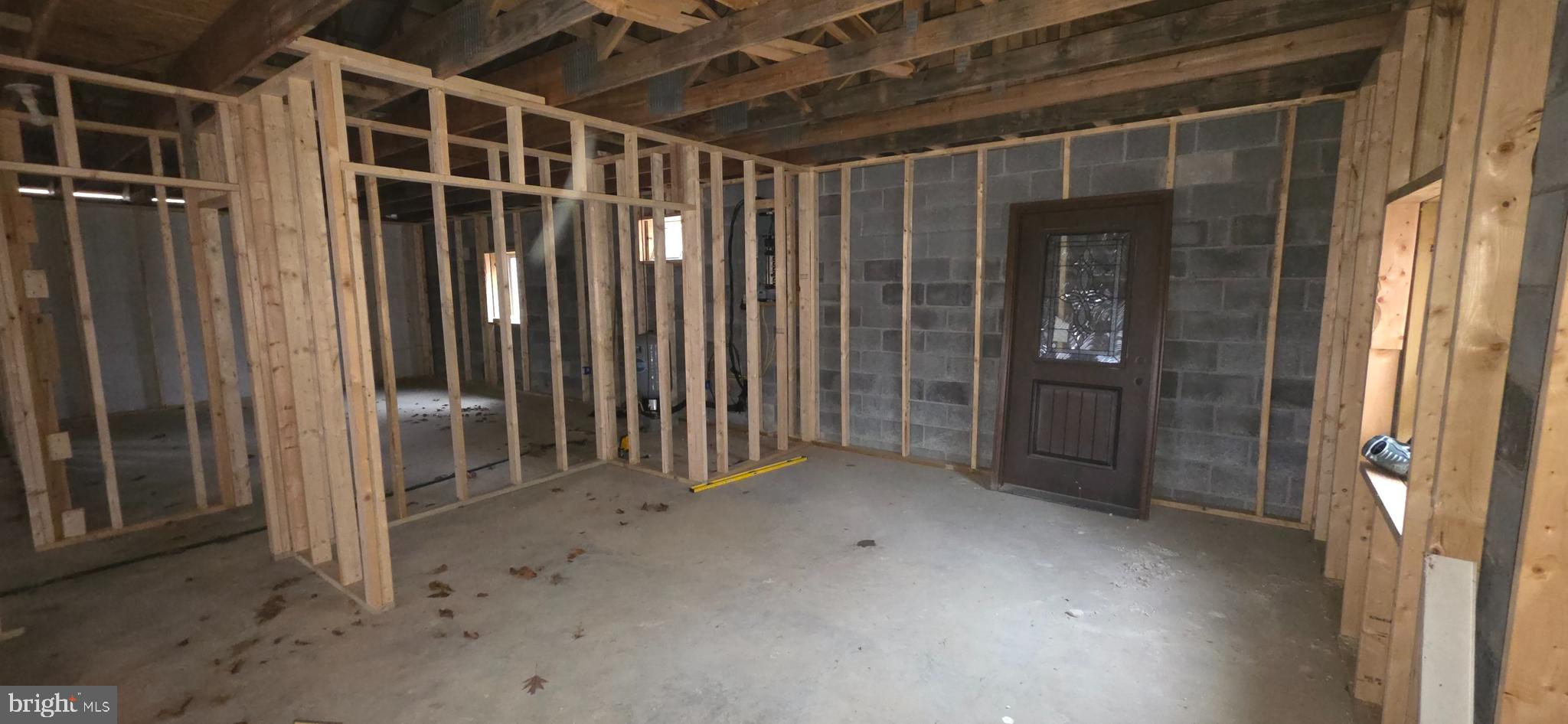 3395 Fingerboard Road Oakland, MD 21550 - Photo 18 of 20 a view of an empty room with wooden floor and a window