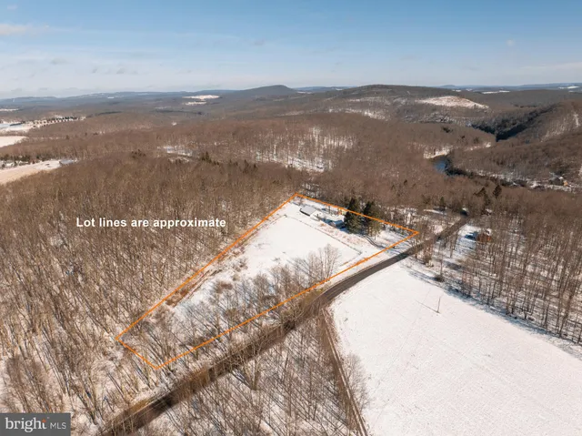 a view of snow on the road