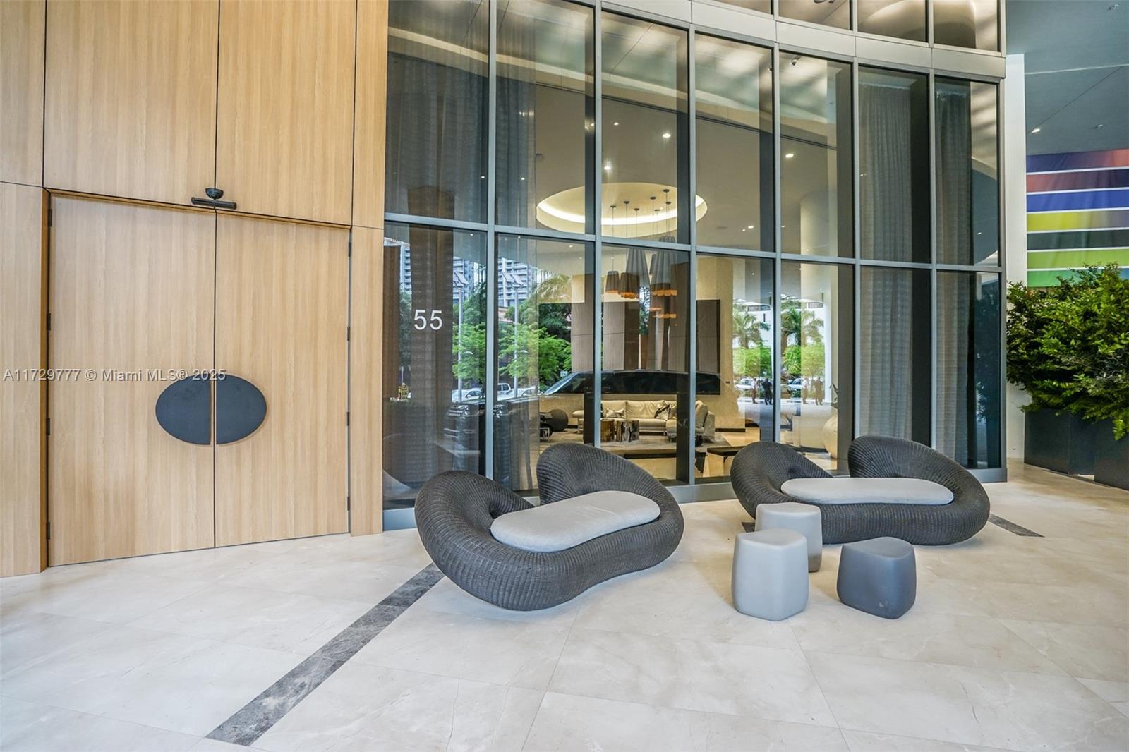 Brickell Miami, FL 33130 - Photo 23 of 24 a living room with furniture and a floor to ceiling window