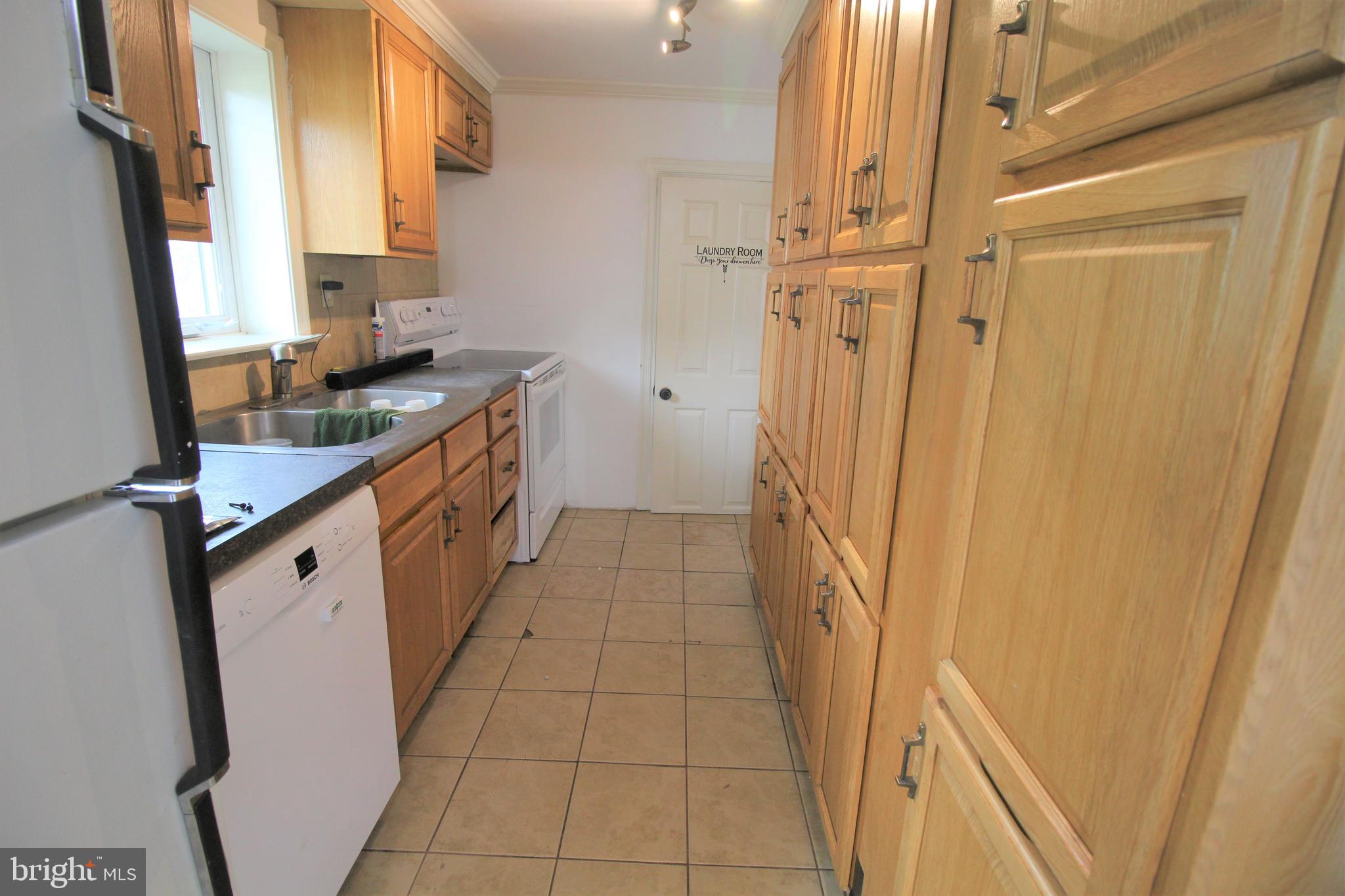 535 West Church Road Ephrata, PA 17522 - Photo 5 of 12 a kitchen with stainless steel appliances a sink and a refrigerator