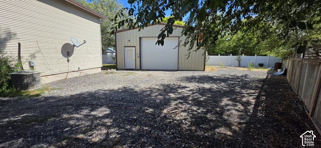 2989 Rae Street West Valley City, UT 84120 - Photo 19 of 25 Metal-sided detached garage with overhead door and side entry