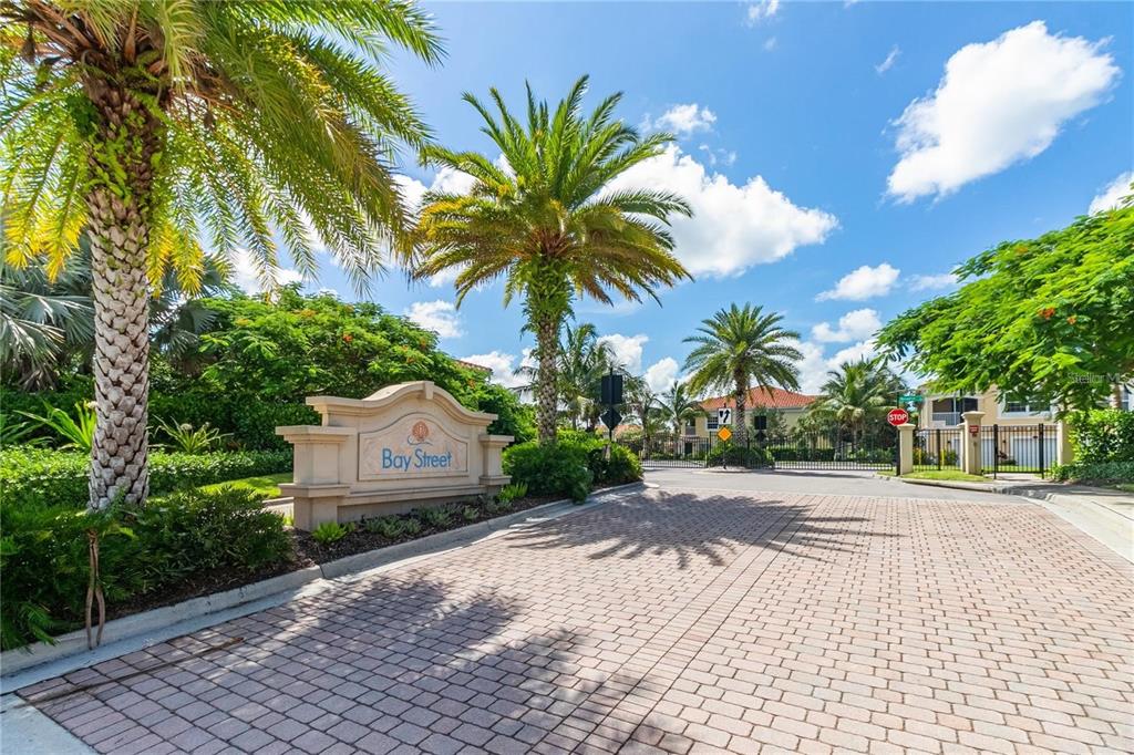 4212 Expedition Way Osprey, FL 34229 - Photo 27 of 28 a house with palm tree in front of it