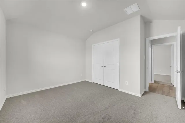 a view of an empty room and closet